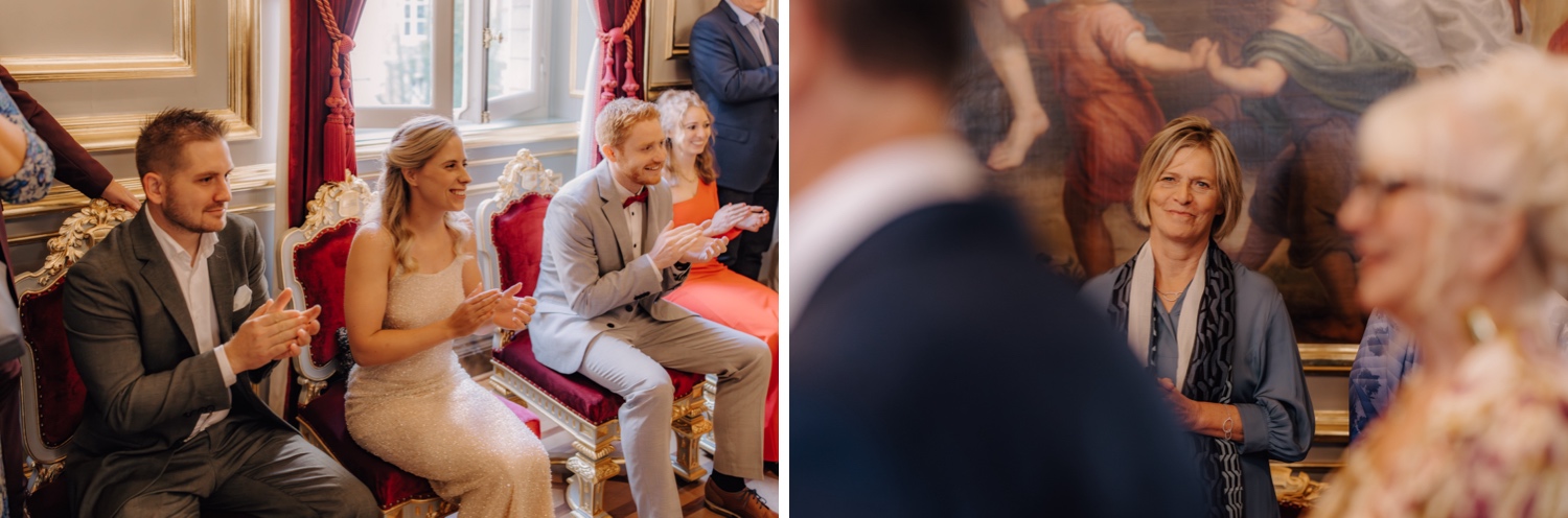 gasten applaudisseren het bruidspaar in het Stadhuis van Leuven